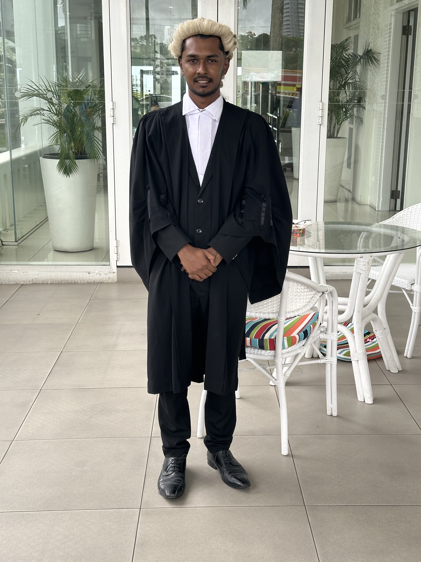 Mr Ritick Prasad wearing court robes and a legal wig